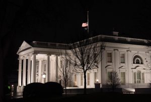 Why are US flags being flown at half-staff on Inauguration Day?