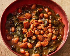 Flavorful chorizo brings meaty depth to a paprika pinto bean soup with collard greens