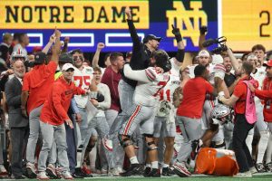 Ohio State wins 1st national title since 2014, outlasting Notre Dame 34-23 in CFP championship game