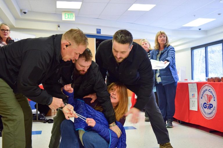 Chaos at Idaho town hall: Plainclothes men drag woman out after she heckled speaker